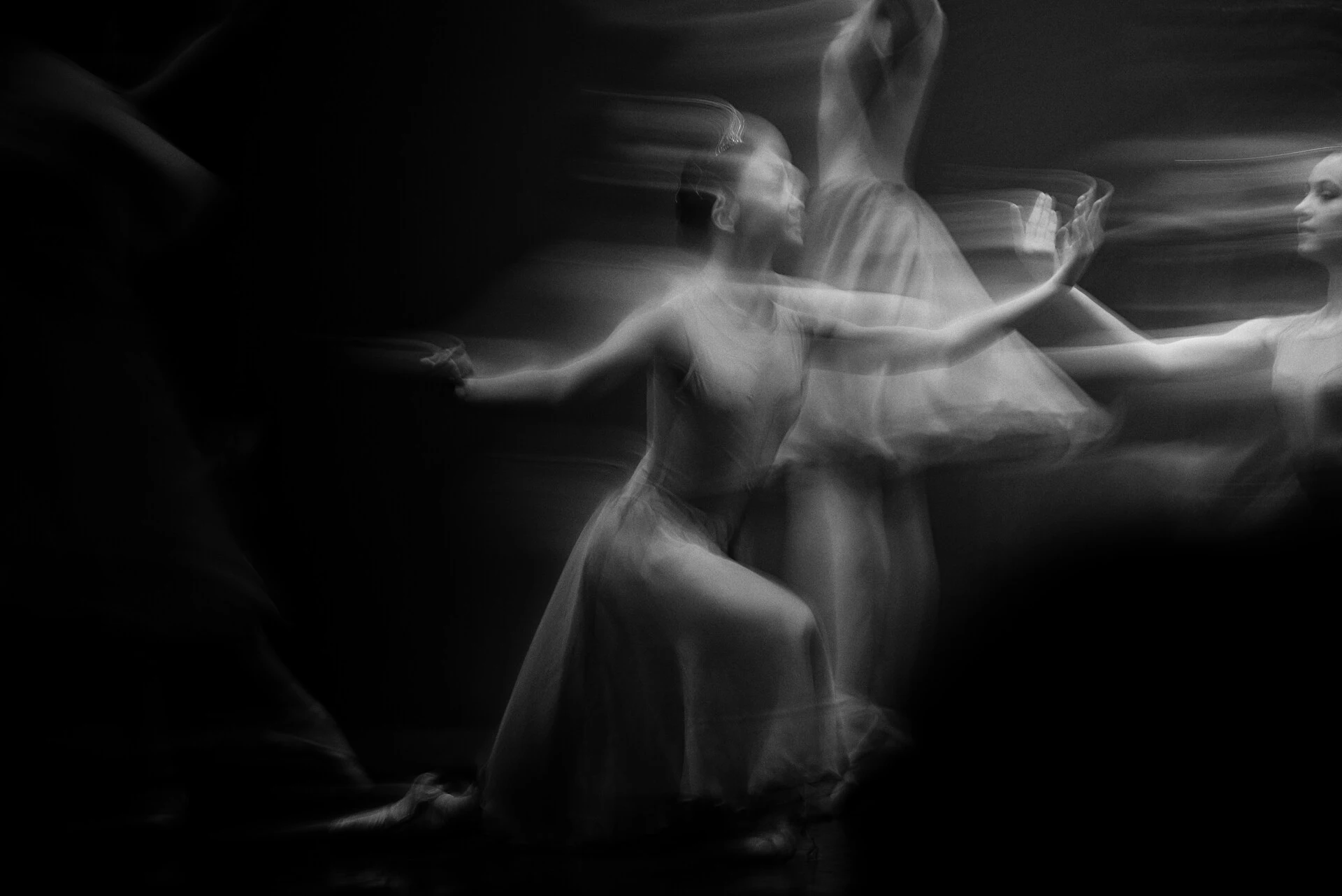Ballroom dancers moving through a quiet contemporary studio